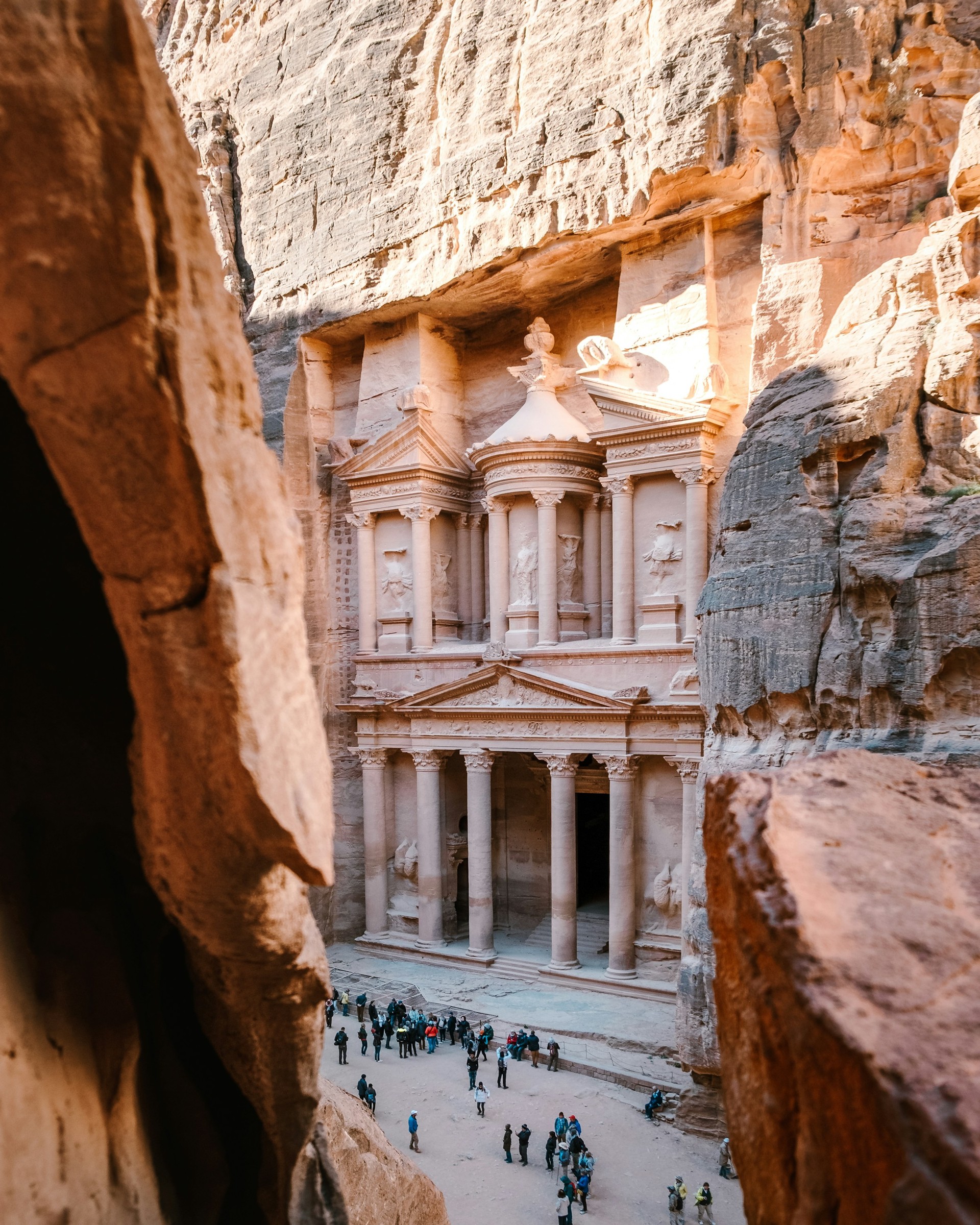 The Treasury facade carved into sandstone cliffs at Petra.