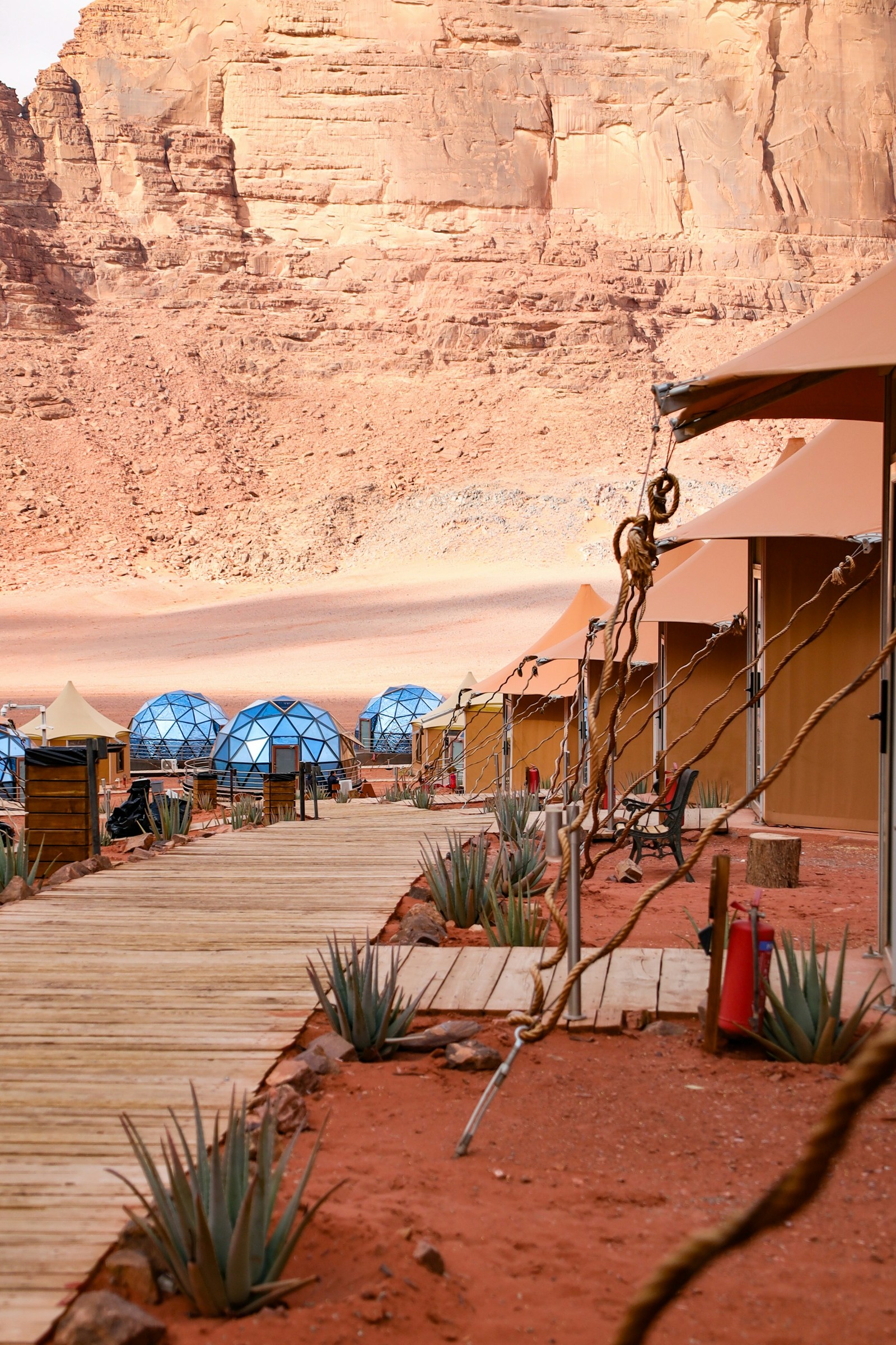 Tents and geodesic domes at a desert camp in Wadi Rum.