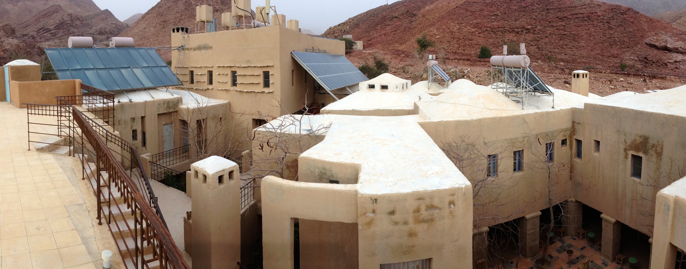 Feynan Ecolodge surrounded by the rocky landscape of Dana Biosphere Reserve.