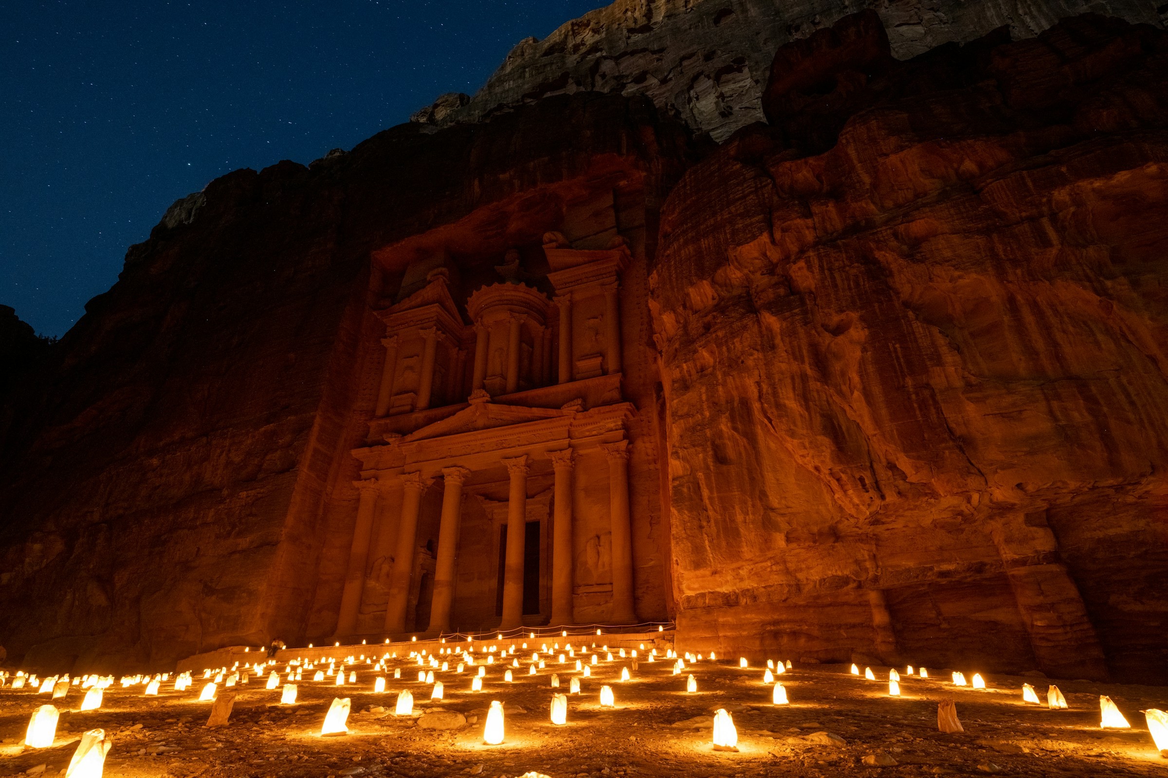 Candles illuminating the Treasury at Petra after dark.