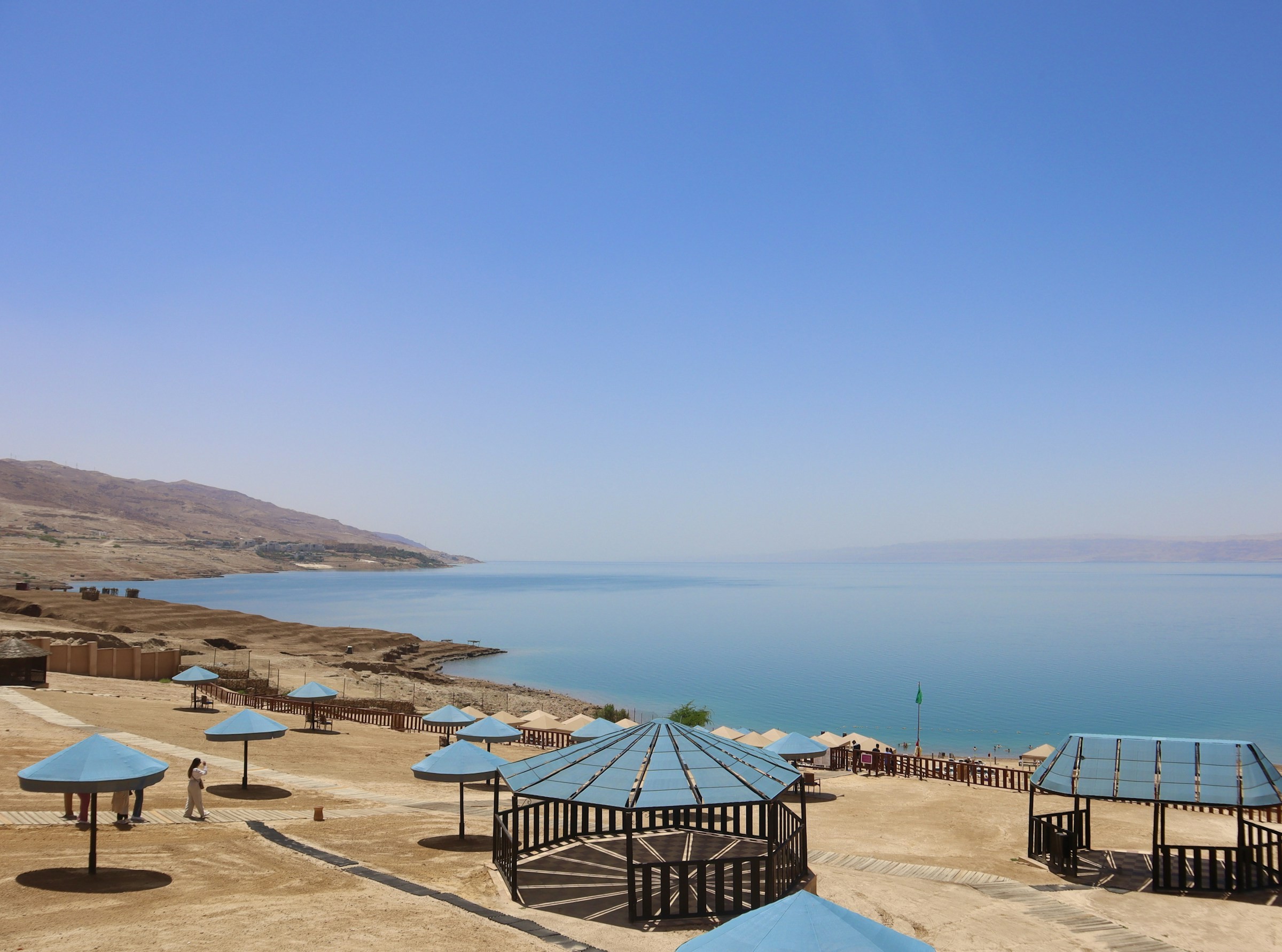 Beach umbrellas beside the Dead Sea in Jordan.