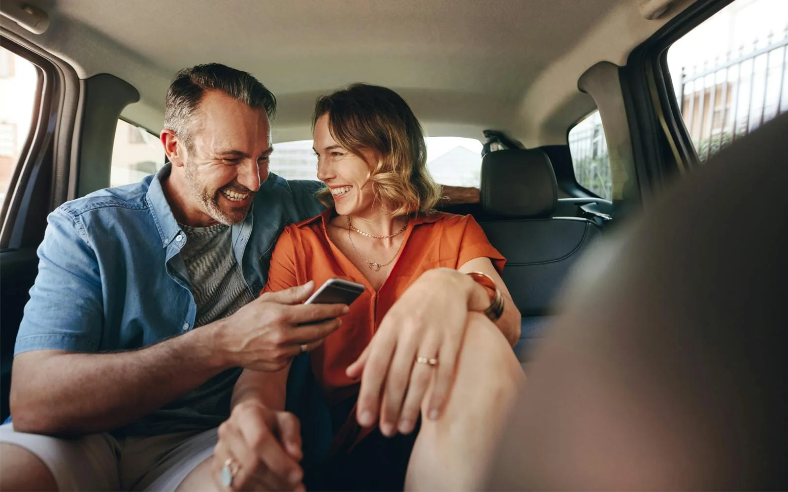 Couple seated comfortably in a private sedan transfer in Jordan
