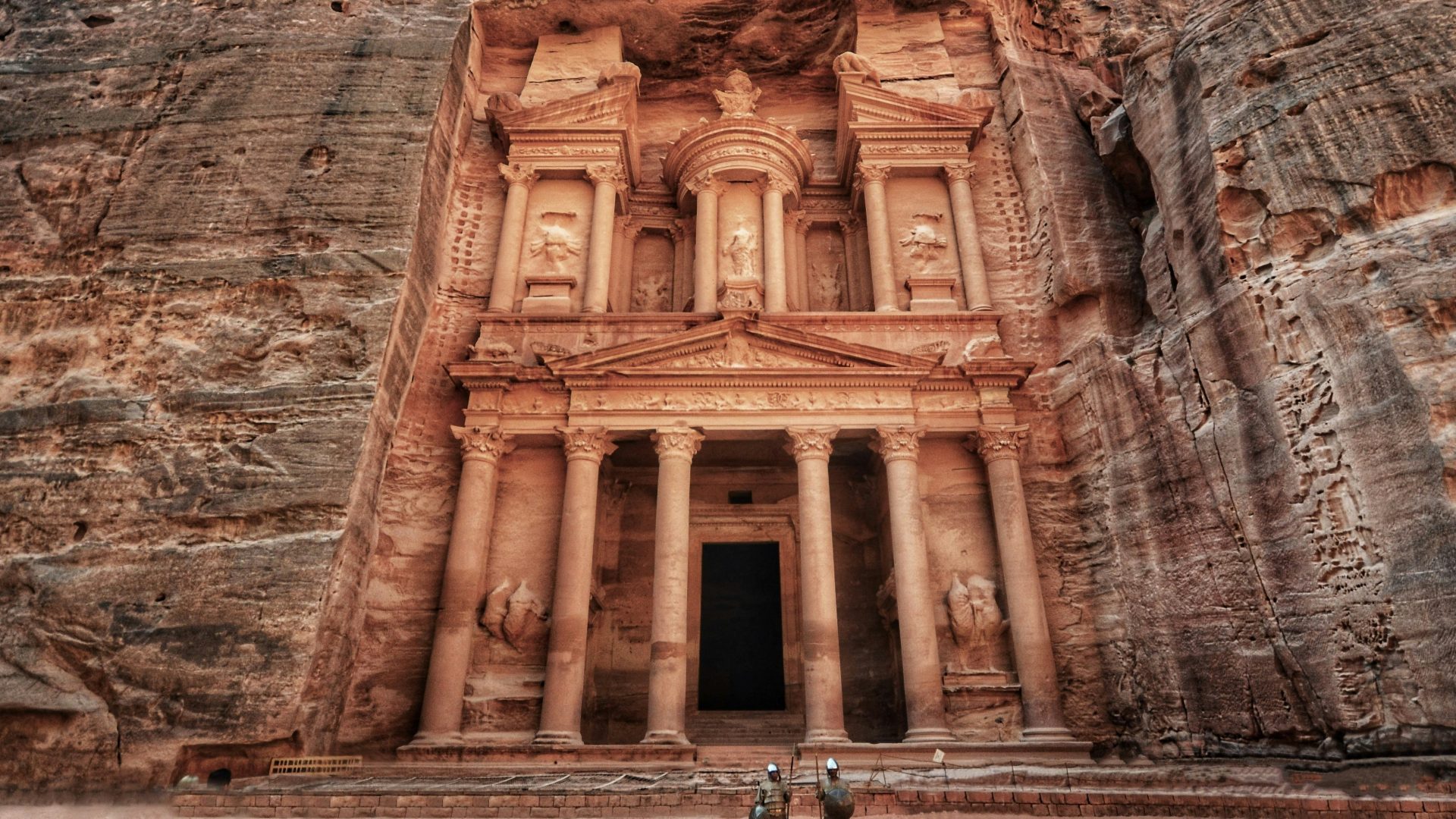 Al-Khazneh Treasury carved into rose-red sandstone cliffs in Petra Jordan