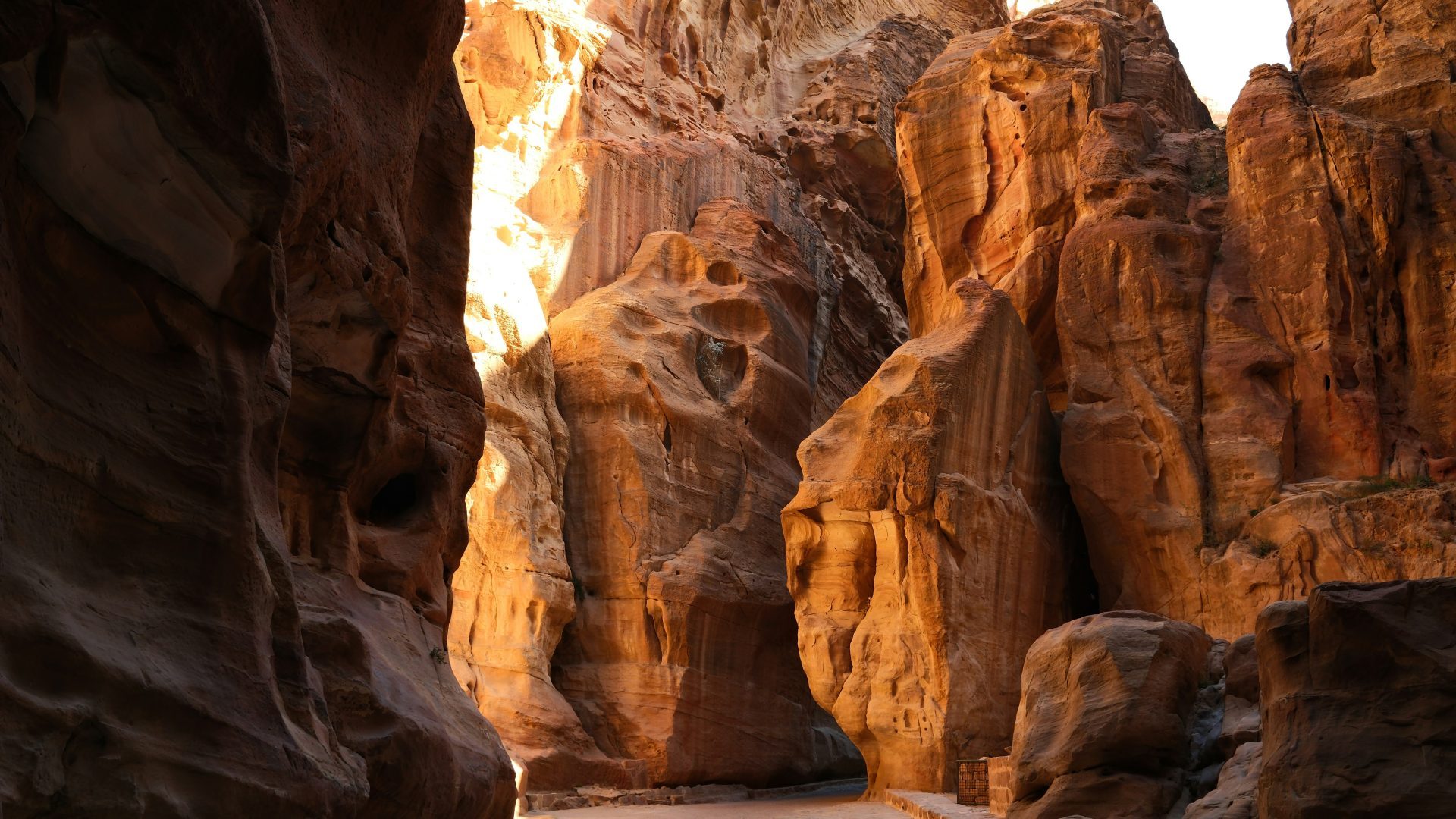 Sandstone canyon passage through the ancient city of Petra Jordan