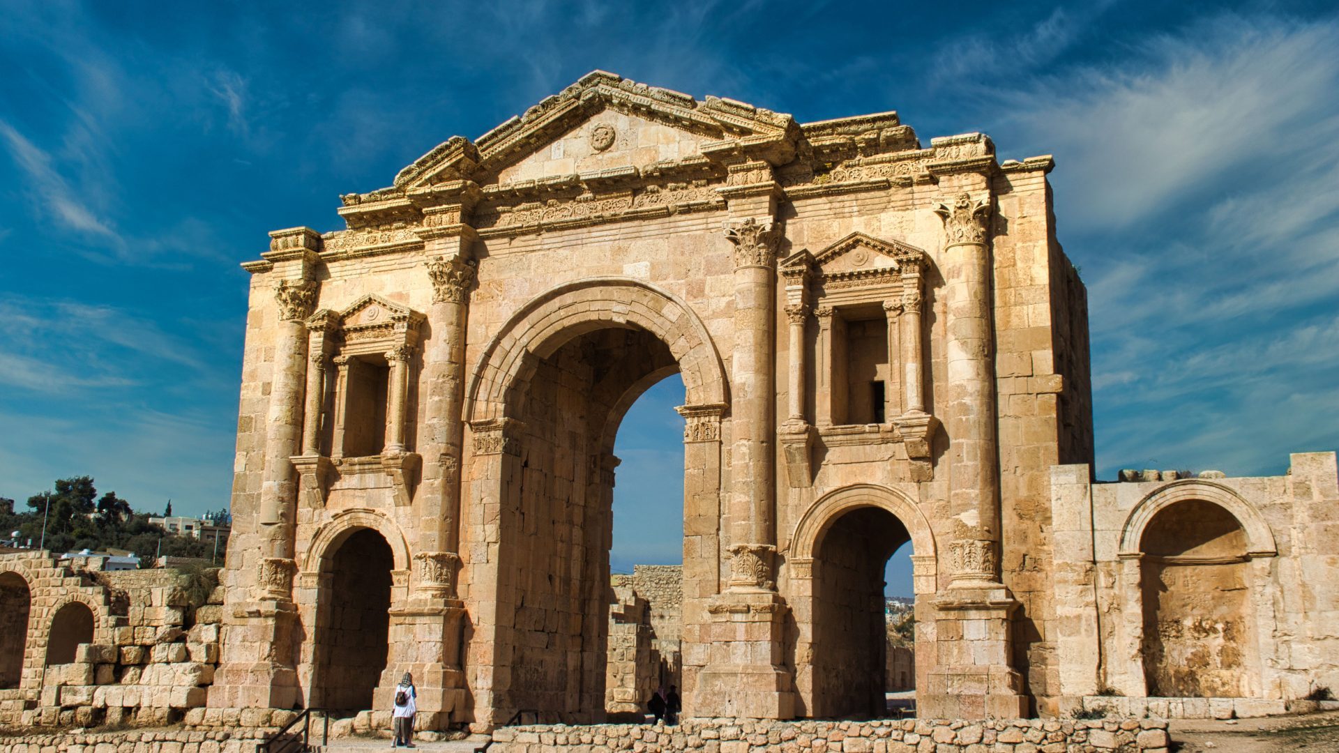 Hadrian’s Arch in Jerash, Jordan, a monumental ancient Roman gateway featuring grand stone arches, Corinthian architectural details, and historic archaeological ruins