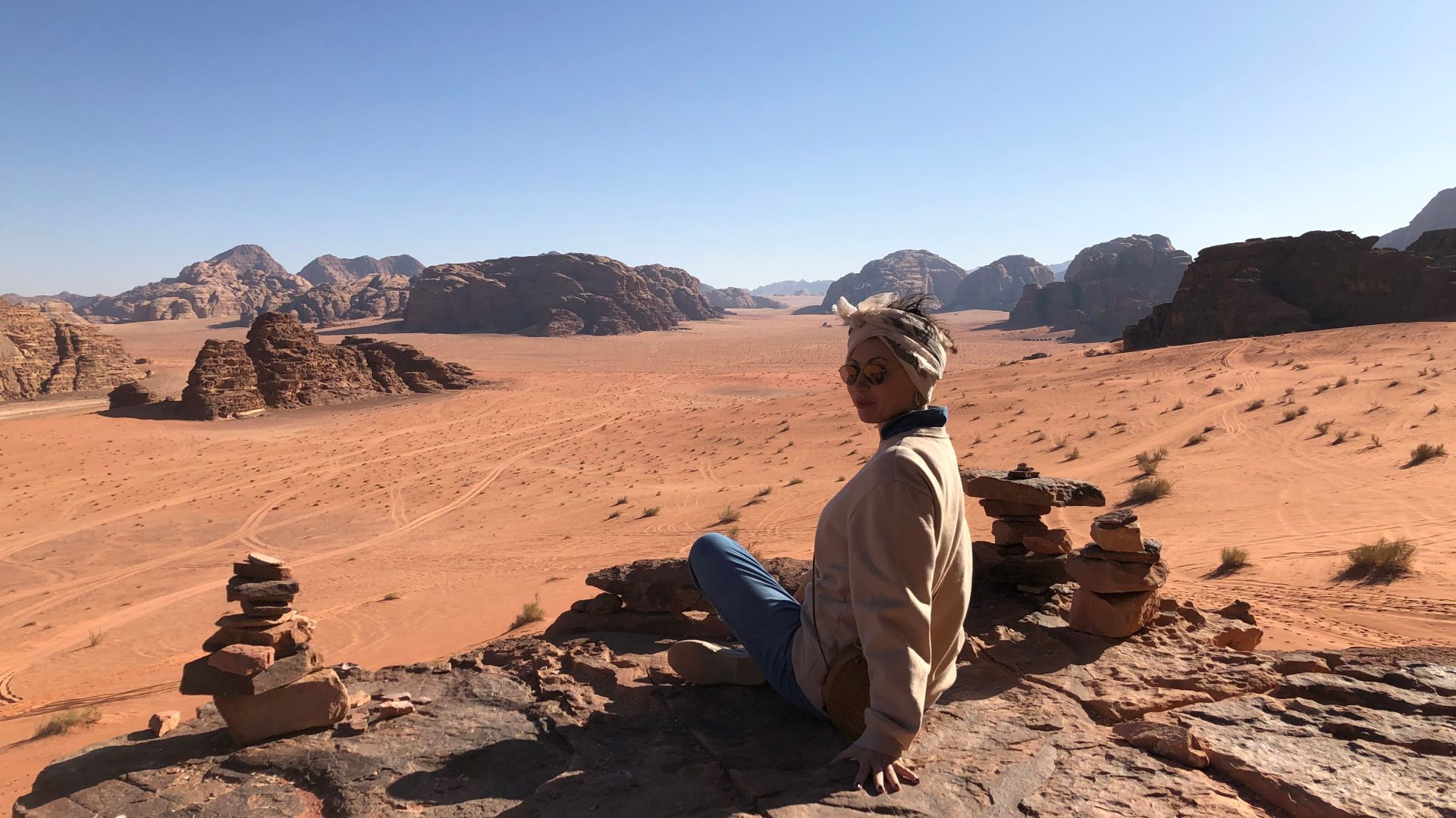 Traveler overlooking the Wadi Rum desert landscape in Jordan