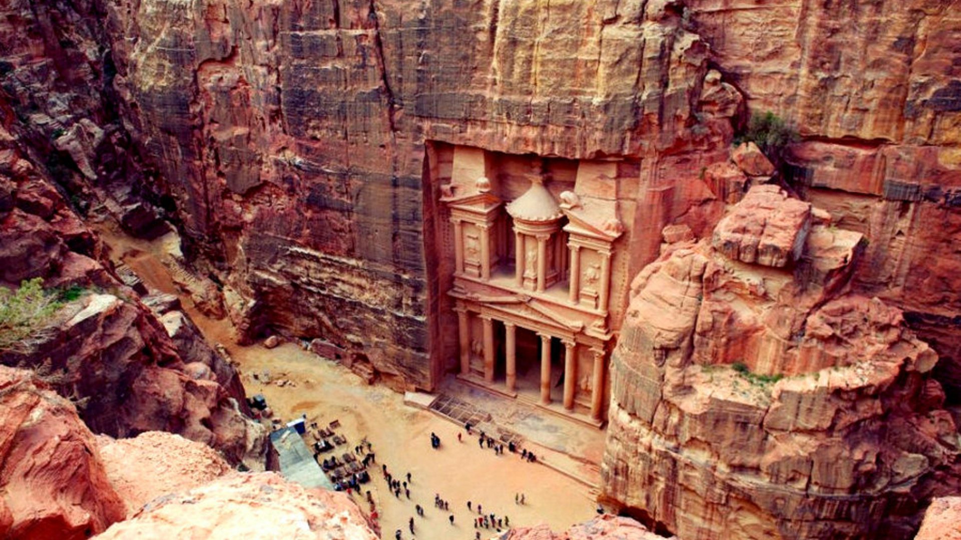 Al-Khazneh Treasury surrounded by rose-red sandstone cliffs in Petra Jordan