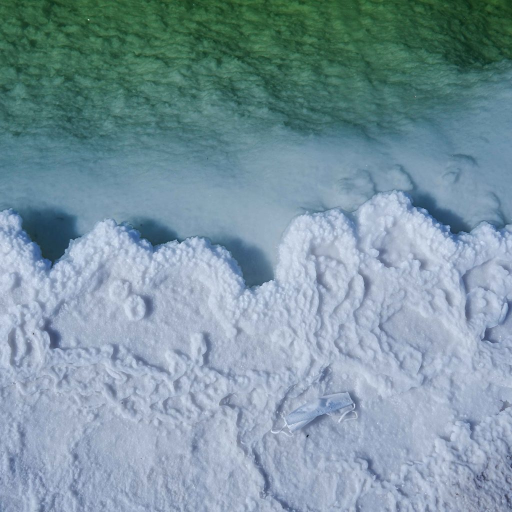 Aerial view of salt formations along the Dead Sea shoreline in Jordan