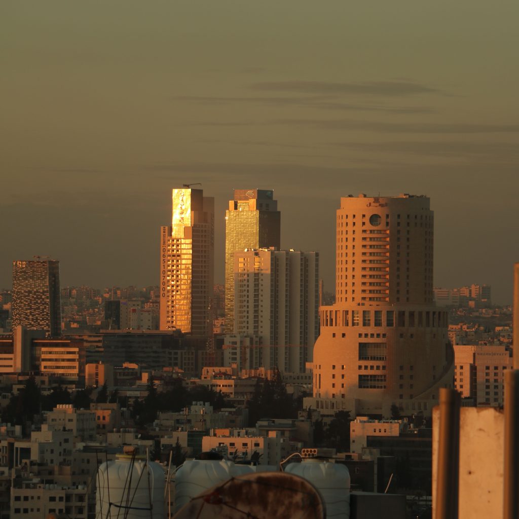 Amman city skyline and modern high-rise buildings at sunset, Jordan